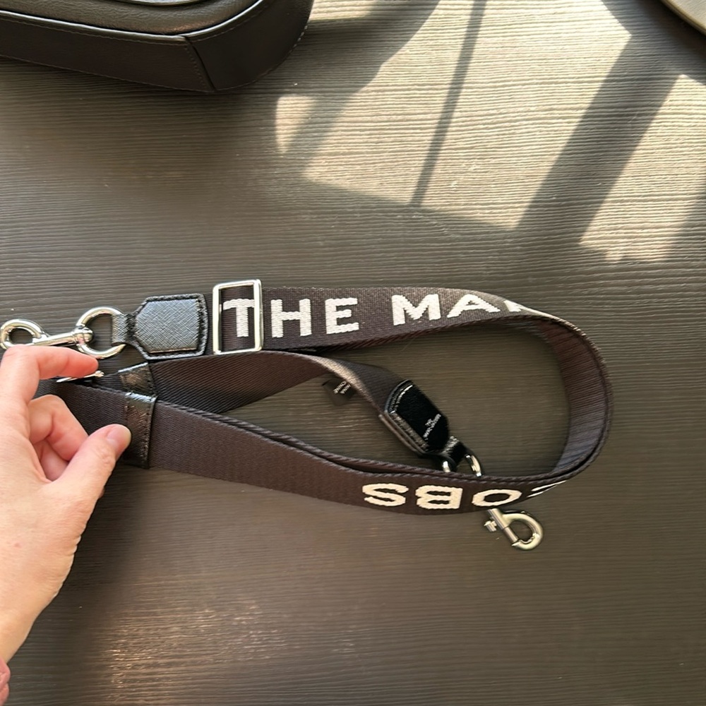 The Marc Jacob’s printed black purse strap silver hardware